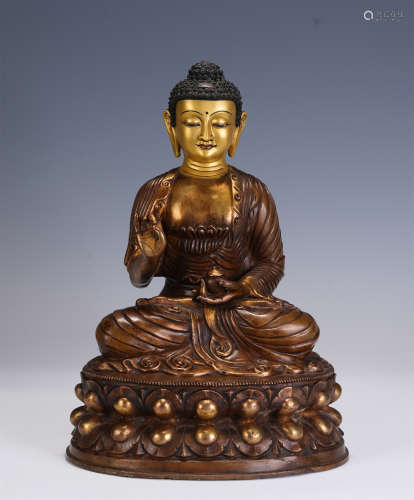 A CHINESE BRONZE GILT STATUETTE OF SAKYAMUNI