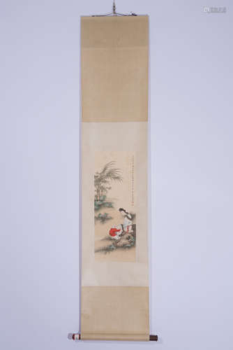 A CHINESE SCROLL PAINTING OF LADY AND CHILD