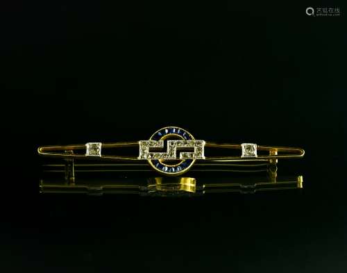 Art Deco brooch 18 kt yellow and white gold, featuring a Gre...