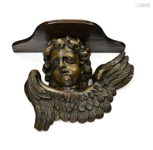 Cherub's head 17TH CENTURY WORK carved wood, mounted on a sc...