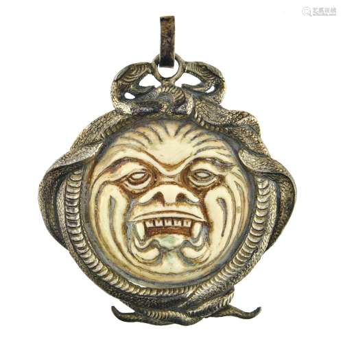 LALIQUE Grotesque head and snake pendant Silver and ivory, s...