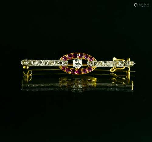 Small brooch 18 kt yellow and white gold, set with small rub...