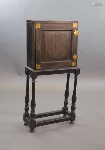 An early 18th century European japanned cabinet on stand,the...