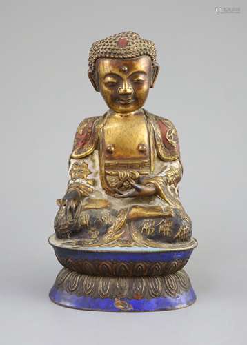 A Chinese copper alloy and enamel seated figure of Buddha Sh...