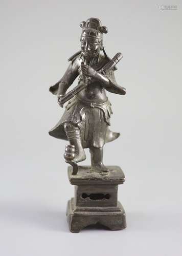 A Chinese bronze figure of an immortal, late Ming dynasty,ho...