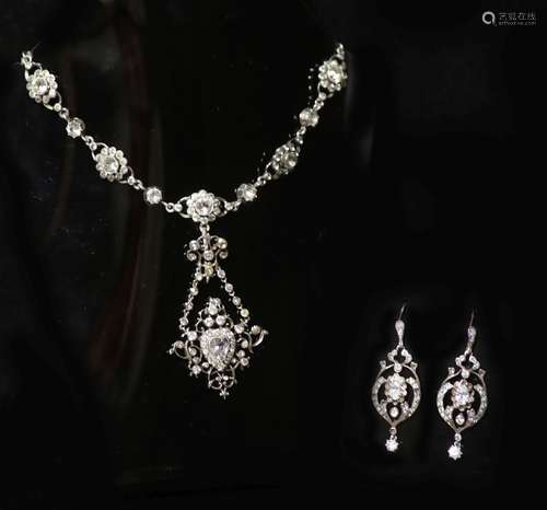 An ornate silver and paste set drop pendant necklace and pai...