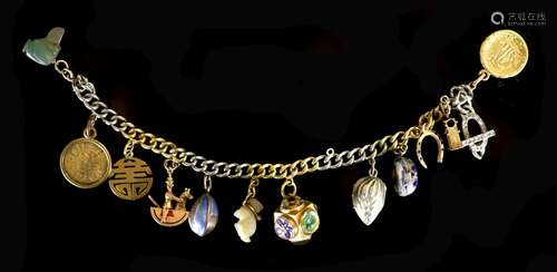 A platinum and gold curb link charm bracelet, hung with twel...