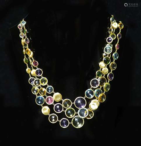 A modern Italian gold and graduated multi gem set three row ...