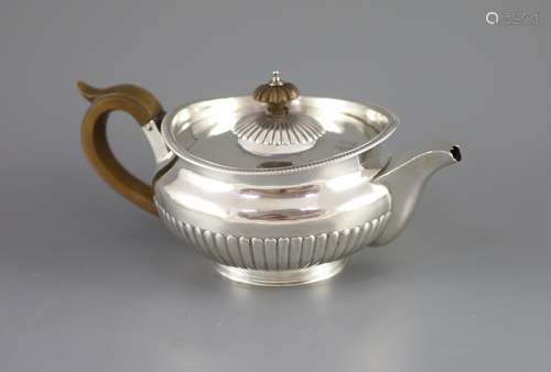 A George III demi-fluted silver squat circular teapot, by Ro...