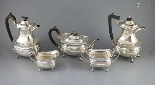 A matched silver five-piece tea service of reeded oval form,...