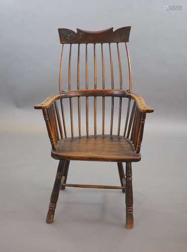 A primitive comb back Windsor armchair, possibly West Countr...