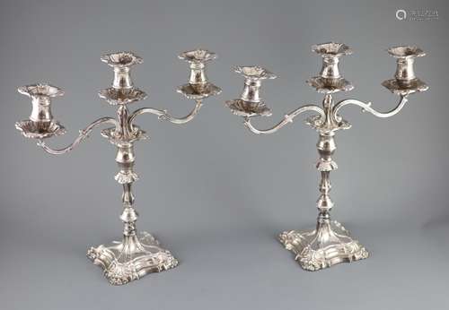 A modern pair of silver two branch, three light candelabra b...