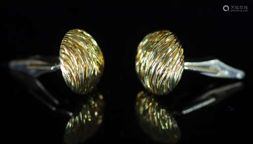 A modern pair of Kutchinsky 18ct gold cufflinks,of textured ...