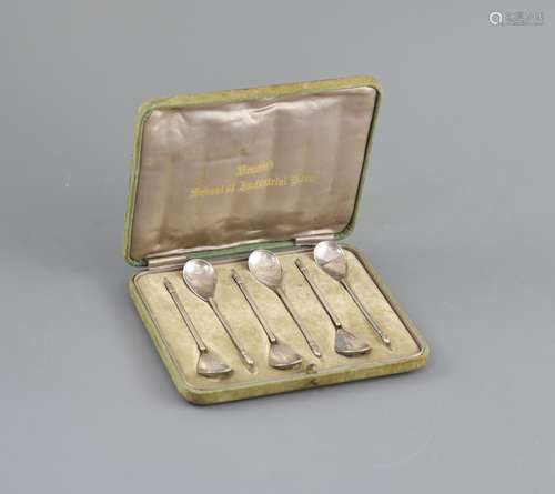 A cased set of six George V Arts & Crafts silver teaspoons, ...