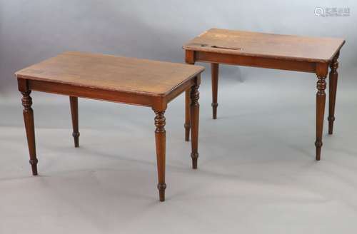 A pair of late Victorian mahogany writing tables,with rounde...