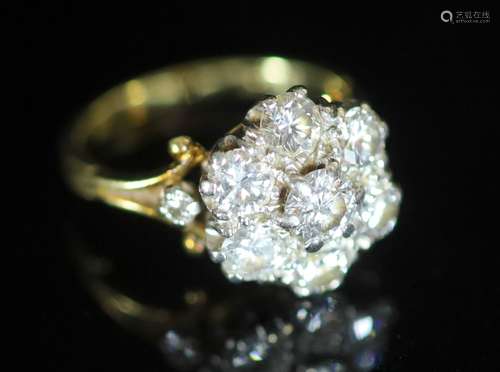 A mid 20th century gold and seven stone diamond cluster ring...