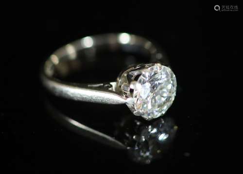 A modern 18ct white gold and solitaire diamond ring,the ston...