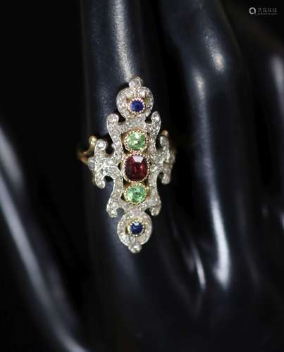 A 20th century ornate gold, garnet, peridot, sapphire and di...