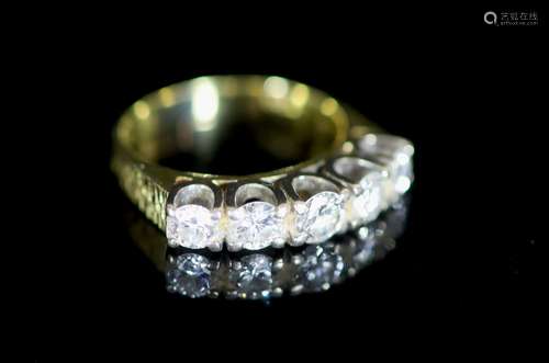 A modern 18ct gold and graduated five stone diamond set half...