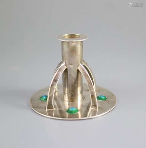 An Edwardian Arts & Crafts silver and enamelled dwarf candle...