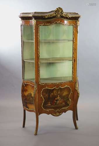 A Louis XV style mahogany vitrine,of serpentine form with a ...