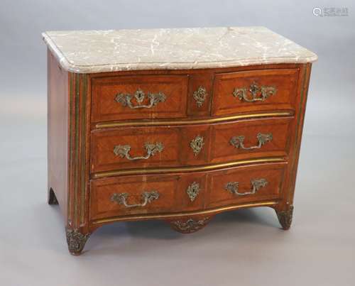 A Louis XVI parquetry serpentine commode,with variegated gre...