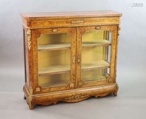 A Victorian ormolu mounted marquetry inlaid walnut bookcase,...