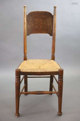 A set of six oak chairs, including a pair of carvers, in the...