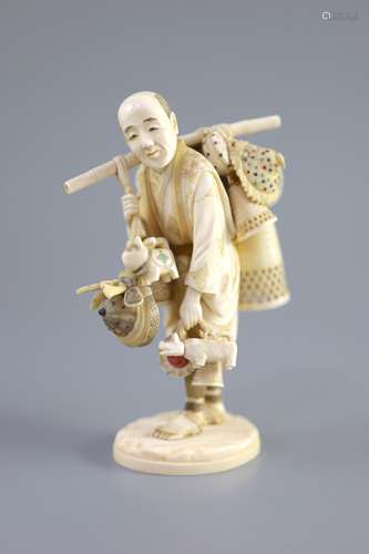 A Japanese ivory okimono of a basket seller, early 20th cent...