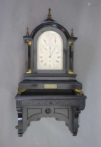 A large late Victorian ebonised bracket clock with bracketth...