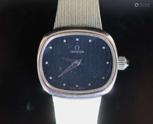 A lady's modern 9ct white gold Omega manual wind wrist watch...