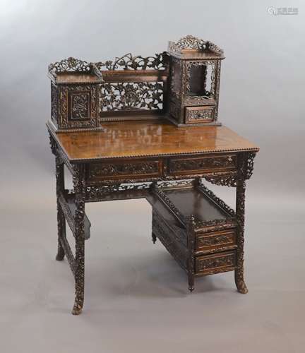 A late 19th century Chinese hongmu desk,carved and pierced t...