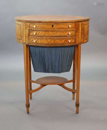 A George III rosewood banded satinwood oval work table,with ...