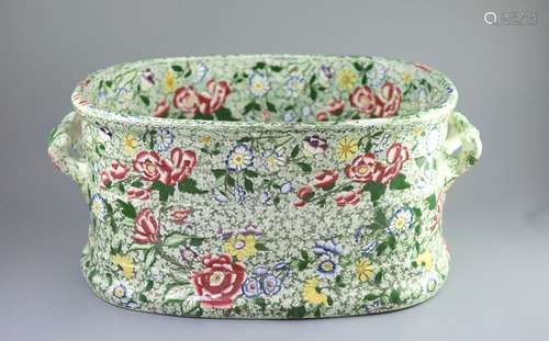 A Victorian ironstone two handled footbath, c.1840,green pri...