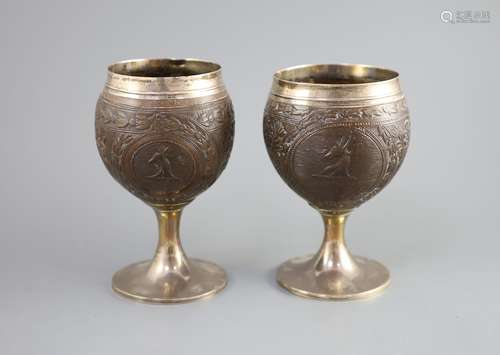 A pair of George III silver mounted coconut cups by Phipps &...