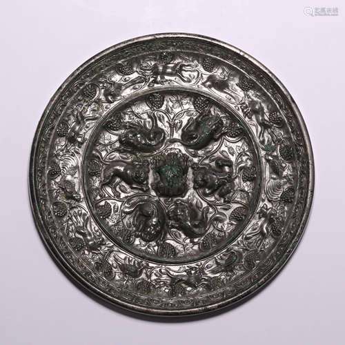 A Bronze Sea Beast And Grapevines Circular Mirror