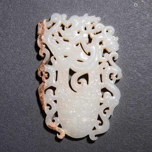 A Carved White And Russet Jade Chilong Pendant