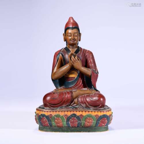 A Painted Wood Statue Of Lama