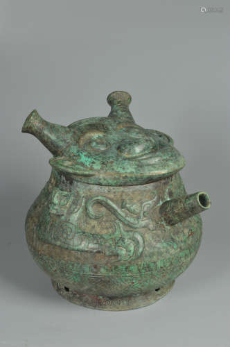 AN ARCHAIC BRONZE FIGURAL POT AND COVER, HE