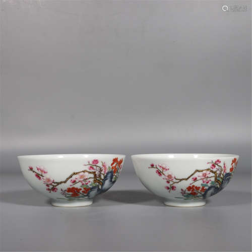 A PAIR OF FAMILLE ROSE PRUNUS AND STONE BOWLS