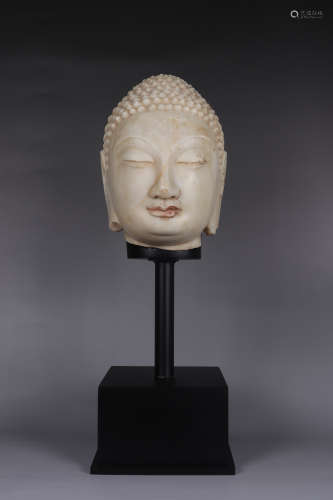 A MARBLE CARVING OF BUDDHA HEAD