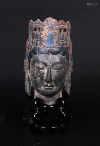 A PAINTED QING STONE BUDDHA HEAD