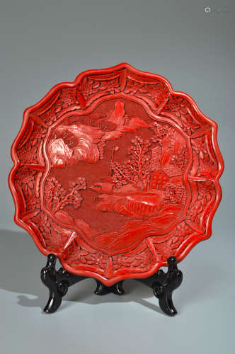 A CARVED CINNABAR LACQUER HUI MOUNTAINS AND PAVILION FOLIATE...