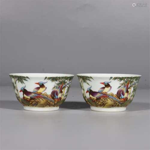 A PAIR OF FAMILLE ROSE BIRD GROUP AND BAMBOO CUPS