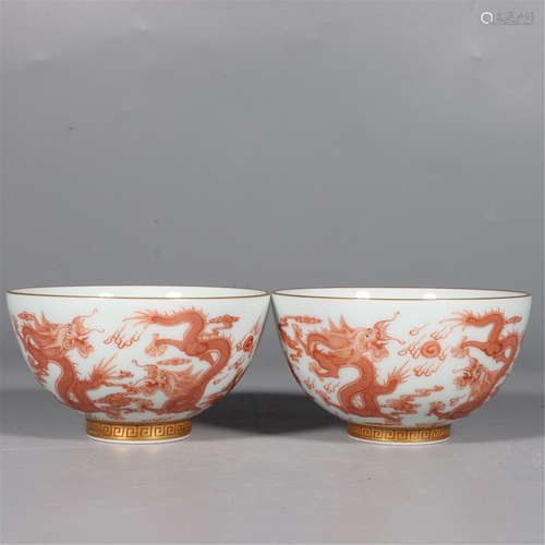 A PAIR OF IRON-RED-GLAZED DRAGON AND PEARL BOWLS