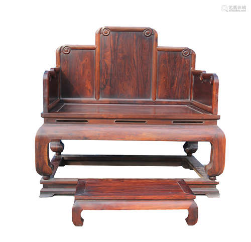 A CHINESE WOOD HUALI ARMCHAIR AND FOOT TABLE