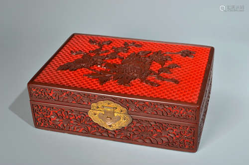 A CARVED CINNABAR AND BROWN LACQUER FLORAL BOX AND COVER