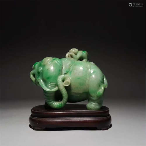A CARVED JADEITE ELEPHANT AND MONKEY ORNAMENT