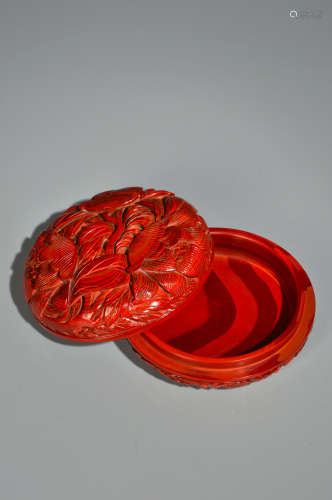A CINNABAR LACQUER FLORAL BOX AND COVER