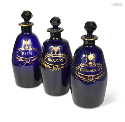 A set of three Bristol Blue decanters and stoppers,